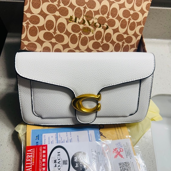 Coach Handbags - Coach White Pebbled Leather Shoulder Bag with Gold 'C' Accent